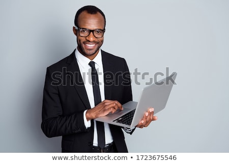 [[stock_photo]]: Businessman Holding A Laptop