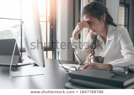 [[stock_photo]]: Tired Businesswoman Sitting At The Table With Laptop