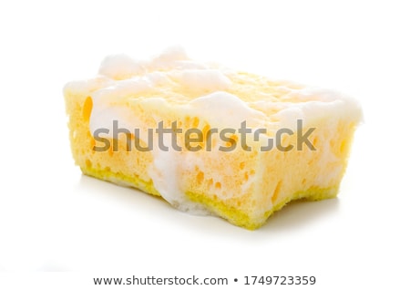 Stok fotoğraf: Gloves And Sponge In Foam On A Blue Background