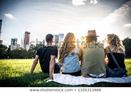 Stockfoto: Friends Having A Picnic In A Field