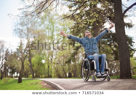 Foto d'archivio: Silhouette Of A Disabled Man On Wheelchair