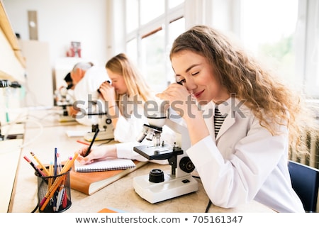 Stok fotoğraf: Teacher And Students Studying Chemistry At School