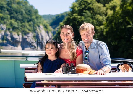 Сток-фото: Family On River Cruise Looking At Mountains From Ship Deck