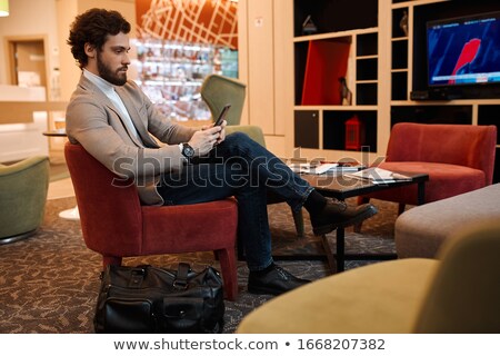 Stock foto: Photo Of Bearded Executive Manager In Suit Holding Mobile Phone