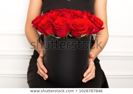 Foto stock: Beautiful Female Holding Red Roses Bouquet