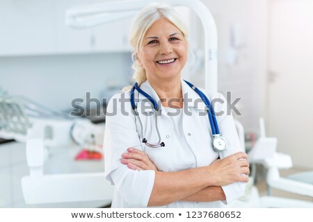 Foto stock: General Practitioner And Female Nurse