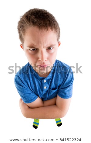 Stock fotó: Mean Young Boy Looking At High Angled Camera