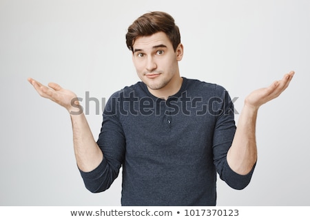 [[stock_photo]]: Portrait Of Confused Handsome Man With Beard