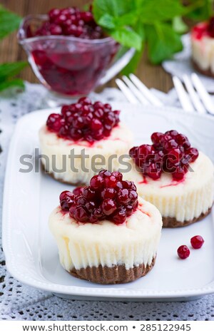 Stock photo: White Chocolate Cheesecake Tart With Cranberries On A White Plate