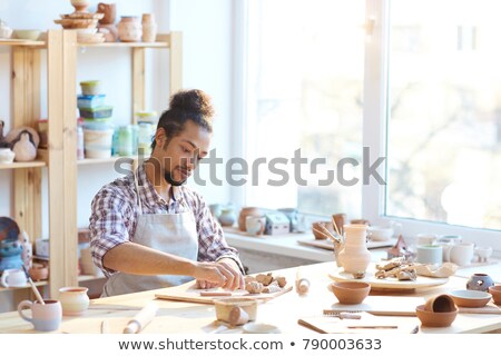 Stock fotó: Skilled Master Preparing Clay Workpieces For New His Creations