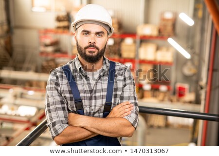 Young Confident Contractor Or Engineering Staff Looking At You In Warehouse 商業照片 © Pressmaster