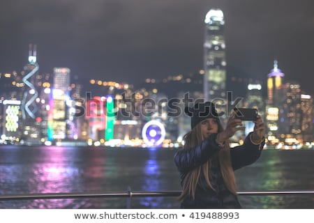 Stock fotó: Young Woman Taking Photos Of Victoria Harbor In Hong Kong China