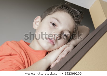 Stockfoto: Sad Child On The Side Of Staircase