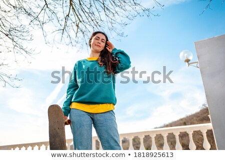 Stock photo: Brunette Walking Over Blue Sky