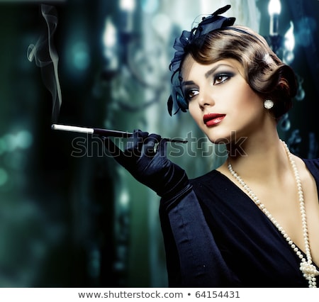 Foto stock: Portrait Of A Beautiful Young Woman With Cigarette