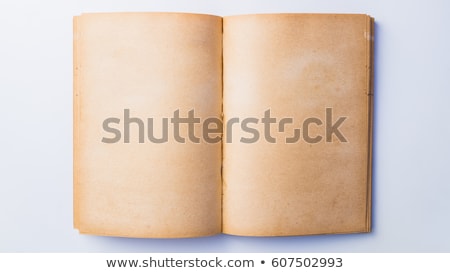 Stok fotoğraf: Man Reading Old Book With Torn Pages