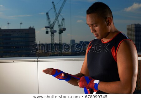 ストックフォト: Boxer Wrapping Hands On Urban Rooftop