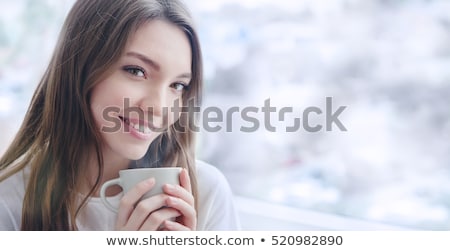 Stock photo: Beautiful Smiling Young Woman With Natural Make Up And Long Eyelashes Holds A Cup With Hot Coffee Or