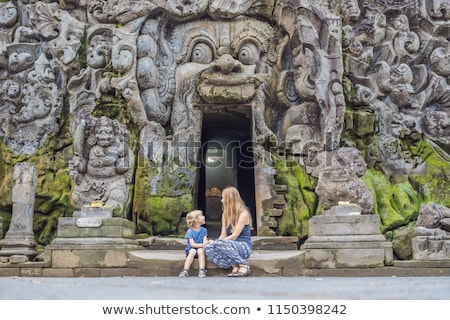 ストックフォト: Mom And Son Are Tourists In Old Hindu Temple Of Goa Gajah Near Ubud On The Island Of Bali Indonesia