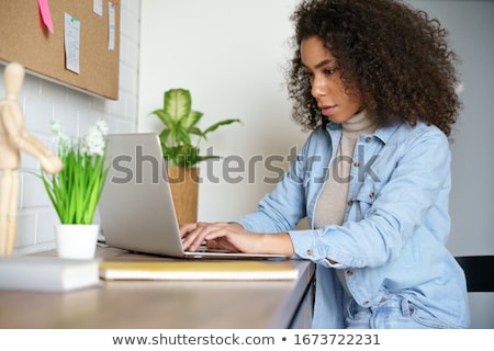 Zdjęcia stock: Serious Staying At Home Woman Sitting At The Table
