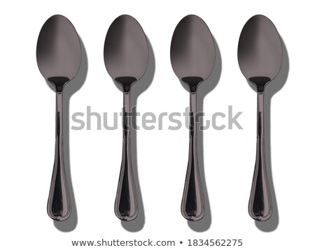 Foto stock: Four Colorful Cups For Tea Or Coffee And Four Colorful Spoons
