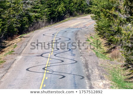 Stock fotó: Wavy Black Mark On Road From Tire Tyre