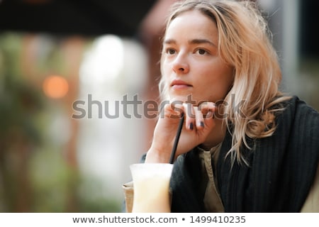 Foto d'archivio: A Pensive Young Woman