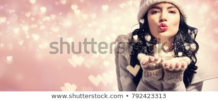 [[stock_photo]]: Woman Blowing Snow