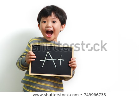 Foto stock: Kid Holding A Chalkboarb