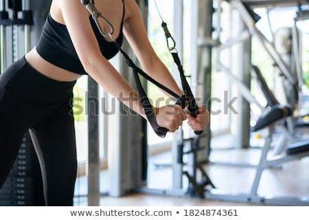 Foto stock: Standing Cable Crossover Fly Flies Woman Workout