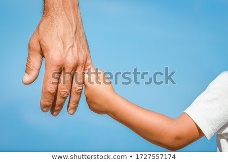 Foto stock: Silhouette Of Two Happy Adults And A Child
