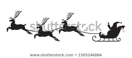 Stock photo: Santa Claus With Gifts Rides On Christmas Deer