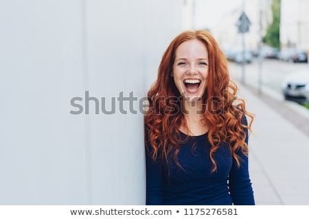 Foto stock: Smiling Redhead Woman