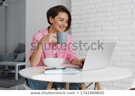 [[stock_photo]]: Woman Having Cup Of Tea
