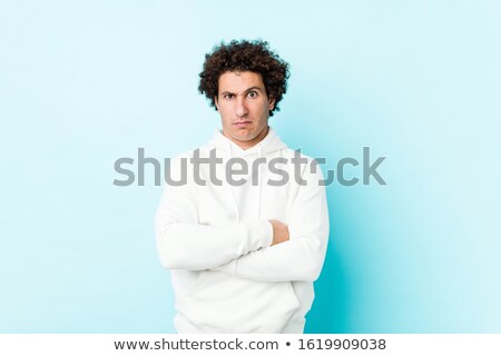 Stock fotó: Doubtful Young Hipster Man Looking At Camera