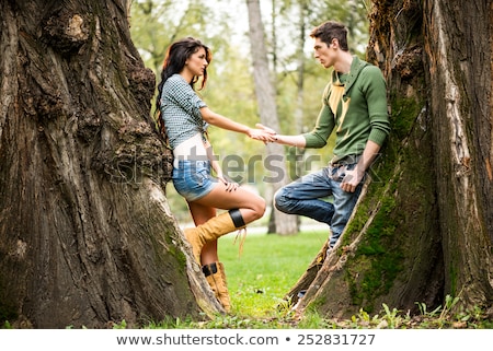Couple Leaning Against Tree Zdjęcia stock © MilanMarkovic78