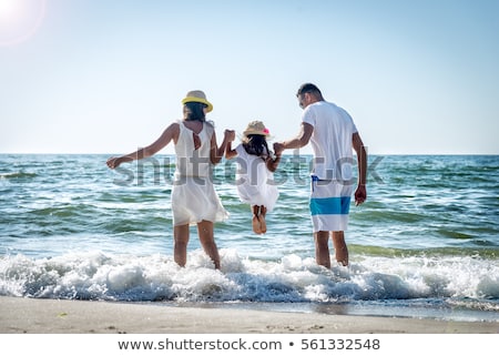 Stockfoto: Happy Family Father And Daughter On Beach Having Fun