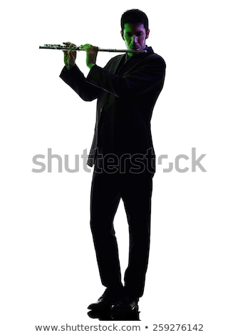 Foto stock: Shadow Of A Musician Playing Flute