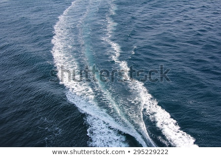 Foto stock: Blue Sea Water With Trace Of The Boat