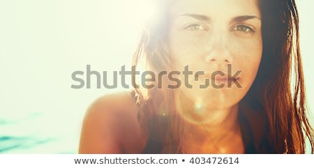 Pretty Young Woman Tanning In The Summer Sun Stock foto © Dundanim