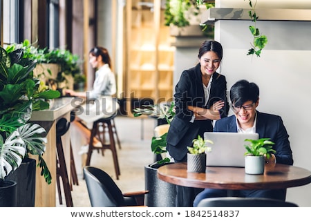 Foto stock: Team Of Creatives Brainstorming At Office Terrace