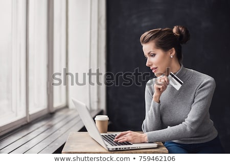 Foto stock: Woman Using A Credit Card For Online Payments The Concept Of On