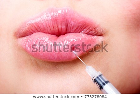 ストックフォト: Beautiful Girl Receiving Filler Injection In Lips Plastic Surgery