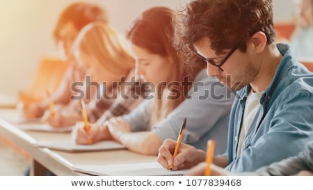 Stock foto: Group Of Students With Notebooks At School Lesson