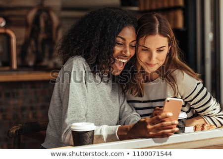 Stock fotó: Fashionable Young Woman Looking Happy For Meeting A Friend In A Coffee Shop