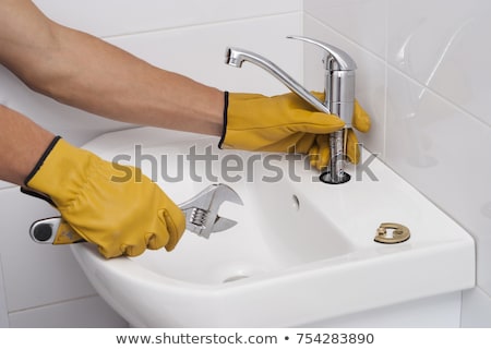 Сток-фото: Worker Fixing Water Tap