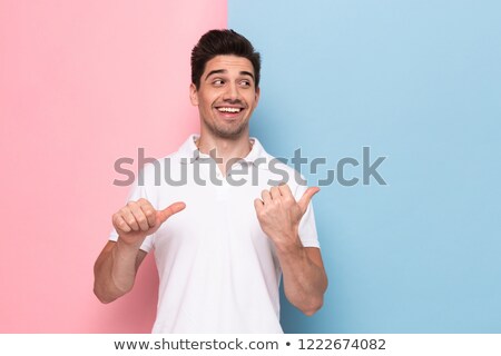 Foto stock: Image Of Optimistic Man 30s Having Stubble Pointing Fingers Asid