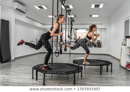 Stok fotoğraf: Sport Blond Makes Exercise With Rope