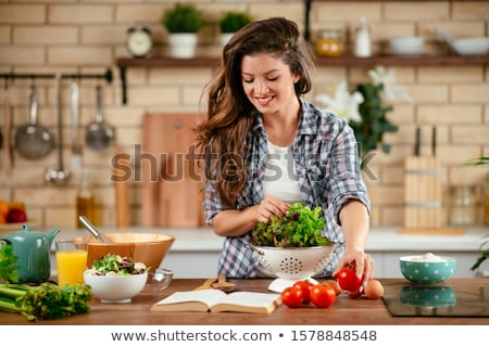 Foto stock: Young Woman Making Salad