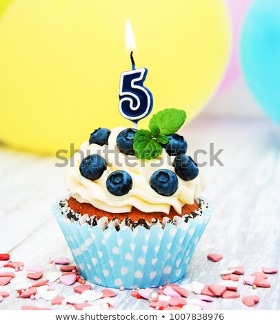 Five Burning Colourful Candles Against Blue Background Foto stock © almaje